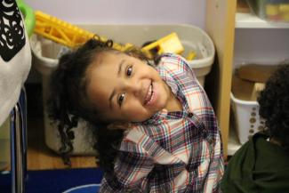 Girl smiling in classroom